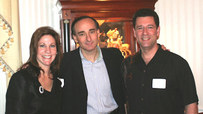 Chris Bohjalian flanked by hosts Dr. and Mrs. Ron and Tammy Smith; photo by Lenny Sukienik (used by permission)